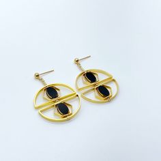 The earrings are light weight and are made to rotate and reposition with movement. The earrings consist of black oval shaped beads. They are new old stock vintage German glass beads that are framed with 24K gold. The beads were hand pressed during the 1920s-1960s. No two beads are exactly alike. These beads are no longer in production thus making them rare and collectible.  Due to the nature of this jewelry, it is unique.  Product Detail:  24K gold edge German vintage glass Bead 24K gold-plated brass metals gold-filled finding and ear wire   *Our jewelry has maximum protection for anti-tarnish and is made for extended wear. You may gently polish your jewelry with a soft jewelry cloth using water and a little soap to restore their brighter finish. Do not rub the vintage glass beads too hard Beads Art, April Birthstone Jewelry, March Birthstone Jewelry, Deco Earrings, Forever Jewelry, Zodiac Jewelry, Art Deco Earrings, Gifts For New Mums, Pearl Jewellery Earrings