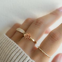 A beautiful floral ring that is meant to inspire you to be your true authentic self! To "Be A Rose" and realize your own beauty and magic lies within you! Rose Gold flower set on a gold or silver band. Made of 925 Sterling Silver We use a THICK plating of 14k Gold, Rose Gold & Rhodium Available in sizes 4-10 Flower measures: Nickel-free & HypoallergenicRings on Model: Mia Ring, Pave Signet Ring, Rope Stacking Ring Rose Gold Jewellery Aesthetic, Rose Gold Flower, Rose Ring, Ring Sizer, Ring Size Guide, Gold Flowers, Signet Ring, Silver Band, Precious Metals