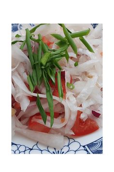 an image of a plate of food with onions and carrots