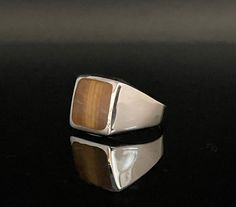 Tiger's Eye Silver Signet Ring Sizes 7, 8, 9, 10, 11, 12 925 Sterling Silver Face Height: 14mm Shank: 5mm tapered Weight: 9 grams Stone: Tiger's Eye (actual stone may vary slightly from pictures) Nickel Free Silver Hallmark 925 Free US Shipping Brown Sterling Silver Signet Ring With Polished Finish, Tigers Eye Gem, Silver Signet Ring, Ring Sizes, Tigers Eye, Hammered Silver, Tiger's Eye, Silver Cuff Bracelet, Silver Cuff