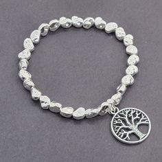 Simple and sweet, this silver-plated charm bracelet makes a great gift or a treat for yourself. It is stretchy to fit all sizes comfortably. Handmade and ethically sourced form Bali. Available with various charms: Flower, Hamsa, Heart, Elephant, or Tree of Life From Suzie Blue Canada Craft Box, Ring Necklace, Tree Of Life, Bracelet Making, Metal Art, Ring Earrings, Silver Plate, Silver Plated, Bali