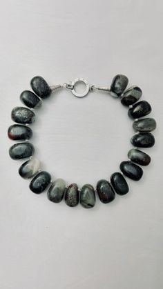 Natural Irregular shaped Bloodstone Modern Silver Jewelry With Gemstone Beads, Modern Silver Necklace With Stones, Elegant Gray Gemstone Beads Necklace, Modern Silver Beaded Necklace, Adjustable Gray Gemstone Beads Necklace, Adjustable Gray Necklace With Gemstone Beads, Adjustable Gray Gemstone Beaded Necklace, Silver Onyx Necklace With Natural Stones, Resin And Clay