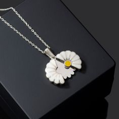 Custom Daisy Necklace in Sterling Silver, Personalized Hidden Message Daisy Pendant is made by hand in our workshop with care. All our jewelry is the most elegant choice for the Bridesmaids, friends, your loved ones and for yourself. Custom Daisy Necklace in Sterling Silver, Personalized Hidden Message Daisy Pendant * Material: High Quality Solid 925 Sterling Silver. * Finish: Sterling Silver ∙ Gold ∙ Rose Gold. * All our jewelry is custom made by hand with care in our workshop.  HOW TO ORDER ❓ White Flower Charm Round Pendant Jewelry, White Round Pendant Jewelry With Flower Charm, White Flower Charm Pendant Jewelry, White Sterling Silver Flower Pendant Jewelry, Unique White Jewelry With Flower Charm, White Sterling Silver Jewelry With Flower Charm, Handmade White Sterling Silver Necklaces, Handmade Sterling Silver White Necklace, Unique White Flower Shaped Jewelry