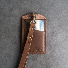 This is the best ID Card Holder and Lanyard that you’ll ever own. The window will show off your ID beautifully and with an extra pocket in the back for a couple of cards, you can carry your essentials securely. Treat yourself to the high quality leather good you deserve.SPECS • Size: Width 2.75” and Height 4.5”• Lanyard Length Options (without ID Card Holder): Short (about 18") and Long (about 24") • Leather Color Options: Choose from Rustic Brown, Dark Brown, Saddle Tan, Rustic Gray, or Black • Leather Id Holder, Rectangular Rfid Blocking Badge Holders For Everyday Use, Leather Card Holder With Id Window For Travel, Leather Travel Card Holder With Id Window, Rectangular Badge Holder With Card Slots For Everyday Use, Rectangular Badge Holder With Card Slots, Leather Card Holder With Interior Key Chain, Everyday Rectangular Card Holder With Id Window, Wardrobe Corner