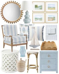 a blue and white living room with pictures on the wall, chair, table, lamp, mirror and other items