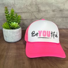 Be You, Your Unique Beautiful Self, And Spread The Positivity With This Cute Trucker Hat! Nwot-Brand New Hat, Never Been Worn. Adjustable/One Size Fits Most. White/Neon Pink. ~Features Six Rows Of Stitching ~Pre-Curved Bill ~Adjustable Plastic Snap Back Closure ~100% Polyester/Foam Front/Mesh Back Height: 4.75" Brim Wide: 6.75" Brim Long: 3" Comfortable, Breathable, Perfect For The Heat Wave! Bring A Smile To Everyone You Pass By While Wearing This Fun, Eye Catching Trucker Hat! White Trucker Hat With Letter Print Visor, White Snapback Hat With Letter Print And Short Brim, White Hats With Letter Print For Spring, Trendy White Trucker Hat With Letter Print, White Hat With Letter Print, One Size, Fun White Visor Hat, Fun White Trucker Hat With Short Brim, Trendy White Trucker Hat With Short Brim, Cute White Baseball Cap For Beach