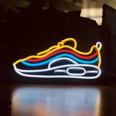 a neon nike shoe is on the table