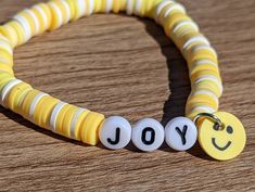 This yellow and white clay bead bracelet will bring you so much joy. Literally. Every time you look down at the smiling face you will remember to have joy in your life and to be happy. You can wear this any day of the week, whether the sun is shining or rain is pouring down. This bracelet will compliment any outfit and make all of your friends jealous. Free shipping! Cheap Yellow Beaded Bracelets With Smiley Face, White Stretch Bracelet With Smiley Face For Gift, Cheerful White Beaded Bracelets With Round Beads, Cheerful Adjustable White Beaded Bracelets, Cheerful White Adjustable Beaded Bracelets, Adjustable Cheerful White Beaded Bracelets, Cheerful White Beaded Bracelet With Round Beads, Cheerful White Beaded Bracelets, Yellow Smiley Face Beaded Bracelets For Gifts