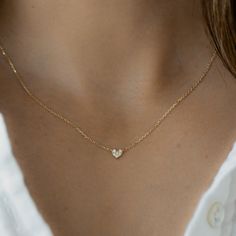 "Super dainty heart necklace that is delicate and great for stacking. It's minimalist design allows for tons of versatility with this piece! It is also great for kids jewelry, as a gift for a loved one, or a token/reminder of self love! Love how small and dainty it is! - - - D E T A I L S - - - * Made of 925 Sterling Silver * THICK plating of 14k Gold or Rhodium  * 16\" + 3\" Extension Chain  * Heart Pendant: 5mm * Nickel-free & Hypoallergenic * Made of the highest quality cubic zirconia stones for an authentic diamond look! Comes in a gift box, ready for gift-giving! 🎁 Made with 100% Pure Love! ♡ Let's Connect! 🥰 IG: samijewels_" Luxury Dainty Heart Cut Necklace, Luxury Minimalist Heart-shaped Necklace, Luxury Dainty Double Heart Necklace, Luxury Dainty Diamond Heart Necklace, Luxury Minimalist Yellow Gold Heart Necklace, Dainty Heart Necklace, Engraved Heart Necklace, Tiny Heart Necklace, Chain Heart