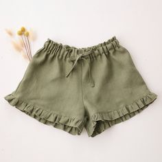 Girl linen shorts with cute little ruffle details all over and elasticated waist. This item is MADE TO ORDER. Please allow up to 3-7 business days production time before shipping.  Material: 100% medium weight linen, Oeko-Tex 100 certified. Size Chart (this item runs a bit big and fits better on a maximum age range indicated, if between sizes better size down): 6-12 months (80 cm / 31.5 in. height) 12-18 months (86 cm / 33.8 in. height) 18-24 months (92 cm / 36.25 in. height)  2-3 YRS (98 cm / 38.5 in. height) 3-4 YRS (104cm / 41 in. height) 4-5 YRS (110cm / 43in. height) 5-6 YRS (116cm / 45.5in. height) 6-7 YRS (124cm / 49 in. height) 7-8 YRS (130cm / 514 in. height) Recommended Care Instructions: Machine wash cold water, delicate cycle, dry gentle. Ruffle Shorts, Linen Shorts, Ukraine, Baby Clothes, Art Collection, Girl Outfits, Bathing Beauties, Purses And Bags