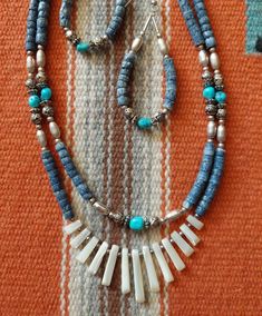 Southwest Vintage Shell and Natural Blue Coral Necklace Set,, Lovely double beaded necklace with turquoise beads, blue coral and liquid silver beads.. the focal point is gradated White Mother of Pearl Shell.. in wonderful condition. Earring length is 2.5 inches and length of necklace is 25 inches. Native Necklaces, Native Necklace, Liquid Silver, Necklace Ideas, Jewelry Cabinet, Medical News, Blue Coral, Mother Of Pearl Necklace, Pearl Necklaces