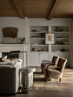 a living room filled with furniture and a fire place