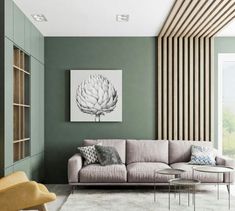 a living room with green walls and white rugs on the floor, along with a gray couch