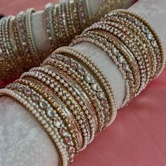 2 small half stacks of pearl bangles with gold shades and clear crystals.  See our size chart to check your bangle size NOTE; style may vary slighty, E.G mirror bangle/ shiney bangle etc Ready to ship! Gold Adjustable Rhinestone Bangle, Adjustable Gold Bangle With Rhinestones, Adjustable Gold Rhinestone Bangle, Gold Stackable Crystal Bracelet For Wedding, Pink Bangles, Desi Jewellery, Pearl Bangles, Gold Shades, Indian Bangles