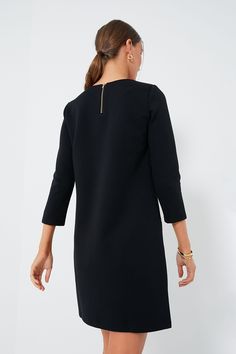 Inspired by the fine craftsmanship of a Parisian atelier, the Black Francoise Mod Mini Dress blends a 60s silhouette with minimalist details. Featuring a shift dress shape, long sleeves, and contrast pockets with buttons, this style is ultra-chic. Pair with gold jewelry for work and heels for date night! Crewneck Three-quarter length sleeves Contrast piping on pockets Gold button details on pockets Shift silhouette Mini length Material: 45% Cotton, 55% Polyester Care: Machine wash cold, tumble d Shift Mini Dress With Long Sleeves For Work, Long Sleeve Dresses With French Seams For Work, Elegant Mini Dress For Work With 3/4 Sleeves, Modern Work Dress With Back Zipper, Modern Workwear Dress With Back Zipper, Long Sleeve Midi Dress With Back Zipper For Work, Long Sleeve Dresses With Back Zipper For Office, Long Sleeve Office Dress With Back Zipper, Midi Dress With Back Zipper For Work In Fall