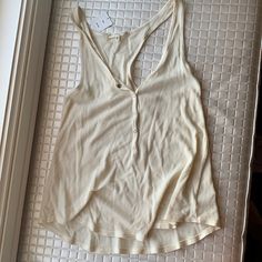 Rand New Urban Outfitters Waffle Tank Top. Off White Color. Never Worn. Button Down. Oversized Affordable Striped Tops From Urban Outfitters, Cheap Urban Outfitters Tank Top For Beach, Cheap Urban Outfitters Tops With Buttons, Casual Beige Tops With Snap Buttons, Sleeveless Tops With Snap Buttons For Spring, Sleeveless Spring Tops With Snap Buttons, Casual Summer Tops With Snap Buttons, Trendy Beige Tops With Snap Buttons, Cream Tank Top For Everyday Summer Wear