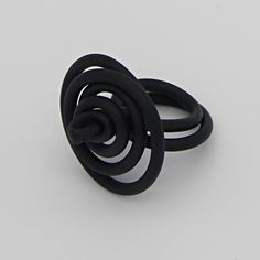 This fun and fashionable ring is unlike anything you'll find in your jewelry box! Made with wire and black rubber tubing, this ring is hand twisted to create a unique design. The tubing keeps this ring super lightweight and the wire makes it easily adjustable to fit any size. This ring will stand out on its own, or complete you can pair it with your favorite necklace! Care Instructions: Remove jewelry when applying perfumes, creams, washing hands etc. Do not store in direct sunlight. to restore Unique Black Spiral Jewelry, Something To Talk About, Funky Rings, Funky Necklace, Washing Hands, Unusual Rings, Bold Necklace, Silicone Ring, Swirl Ring