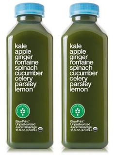 two bottles of green juice with labels on them