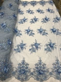 blue and white fabric with flowers on it