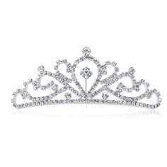 PRICES MAY VARY. As a princess tiara comb, it's brilliant with silver plated metal bend Measured 4.3*4*1.6 inches, great for girls and kids The tiara for women is Light, do not bring a headache. And it also has a comb to hold in place Amazing quality of workmanship of the tiara, is very sturdy and well made It's dainty, fancy gift for birthday, wedding, prom, party This product is a charming and shiny tiara, the adoption of silver plating technology and rhinestone material gives it diamond look Princess Party Costume, Prom Birthday, Rhinestone Material, Rhinestone Tiara, Princess Tiara, Birthday Princess, Fancy Gifts, Tiara Crown, Crown Headband