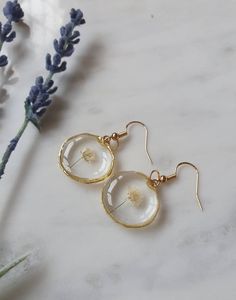 Real pressed white gypsophila earrings preserved in resin in lovely boho style round pendants.  These would make the perfect gift as they come in their own little craft box gift wrapped and can be delivered straight to the door.  The bezels are small and irregular gold or silver circles measuring 2.2cms diameter.  They are on hypoallergenic, gold-plated hooks which are free of nickel and lead (each with a rubber safety back to fix the earring well). May contain some tiny bubbles but they are hardly noticable (see photos). Tiny Resin Crafts, Hypoallergenic Rose Gold Jewelry Gift, Minimalist 14k Gold Filled Jewelry With Flower Charm, 14k Gold Filled Jewelry As Gift, Hypoallergenic Jewelry Gift, Gold Dangle Jewelry For Gifts, Metal Jewelry For Mother's Day Gift, Gold Plated Flower Earrings For Weddings, Gold Plated Round Flower Earrings For Wedding