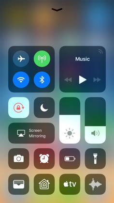 an iphone screen with various icons and buttons on the bottom right corner, including music