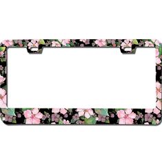 a license plate frame with pink flowers on the front and green leaves on the back