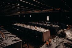 an empty banquet hall with tables and chairs set up for formal dinner or party guests