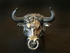 🔱 Embrace the strength, power, and spiritual guidance of the Hell Bull ring. Rise up to any challenge with this extraordinary piece of jewelry loaded with unapologetic Mortis Ores DNA and created with meticulous craftmanship. Designed to honor the fight through any obstacles, this Hell Bull ring will give you the bullish spirit to rise and win it head on. Make it a symbol of your strength and wear it as a statement! 🔱 The ring weighs at approximately 75 grams of 925 sterling silver with 22K go Nice Rings, Black Horns, Bull Ring, Exotic Jewelry, Animal Bones, Bull Skulls, Bespoke Jewellery, Spiritual Guidance, Engraved Jewelry