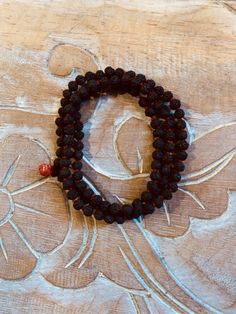 These Rudraksha malas can be worn on wrist or around the neck. Rudraksha beads are known for their healing properties and protective powers. By meditating with a rudraksha mala, it is believed to increase the ability to concentrate, giving clarity and peace of mind. Their size and texture make them great for promoting concentration during meditation.Rudraksha beads are known for their healing properties and protective powers. By meditating with a rudraksha mala, it is believed to increase the ab Rudraksha Mala, Rudraksha Beads, Healing Properties, Memorial Day, Live Lokai Bracelet, Lotus, Floating, Meditation, Mindfulness