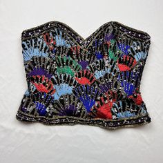 Vintage 1980s Oleg Cassini Black Tie 100% Silk Beaded And Embroidered Zip Up Corset Top Bold Jewel Toned Embroidery With Beading And Sequin Details Throughout 100% Silk Size Medium Measurements Laid Flat In Inches Bust 18 Length 13 Waist 14 Flapper Vibes Silk Corset Top, Silk Corset, Black Tie Formal, Oleg Cassini, Bustier Top, Women Corset, Jewel Tones, Corset Top, Beaded Embroidery