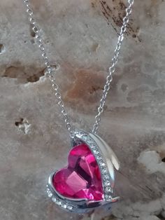 This is a beautiful 925 silver plated chain with Magenta Pink crystal gemstone. Meet Aqueila! She is a Syrah Djinn Grim reaper and looks very similar to the photo. She is very beautiful compassionate to her keeper. She can help with communicating with the deceased as she is the gatekeeper of the spirit realm and serves as a spirit guide to her keep her with guidance on developing your spiritual gifts and abilities. She's very active and loves offerings of cemetary dirt, silver objects, red gemst Silver Heart-shaped Crystal Jewelry, Dazzling Sterling Silver Necklace With Jewels, Crystal Jewelry For Valentine's Day Gift, Crystal Jewelry For Valentine's Day Gift For Her, Crystal Jewelry Valentine's Day Gift For Her, Valentine's Day Crystal Jewelry Gift For Her, Crystal Heart Pendant Jewelry For Her, Crystal Heart Pendant Jewelry Gift For Her, Silver Crystal Heart Pendant Jewelry