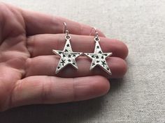 "Love these fun and whimsical star earrings! Made from allergy free, plated silver. They hang from silver plated simple hook earwires. The stars measure 1\" long by 3/4\" across. I have a matching necklace in my shop if you would like the whole set. https://www.etsy.com/listing/256162930/silver-star-necklace-silver-star-pendant?ref=shop_home_active_2 Thanks for stopping by and please take a look at the rest of my shop where you will find many more beautiful adornments. Tiger Flower Jewelry - Ins Silver Star Print Jewelry As Gift, Silver Star Print Jewelry For Gift, Silver Jewelry With Star Print As Gift, Silver Jewelry With Star Print For Gift, Silver Star-shaped Earrings As Gift, Silver Star-shaped Earrings, Star-shaped Pierced Earrings As Gift, Star-shaped Pierced Earrings For Gifts, Star-shaped Earrings For Pierced Ears As A Gift