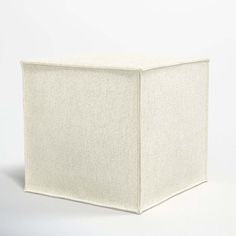 a white cube sitting on top of a table