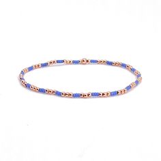 A Solid Statement Band: Flat woven; 1/2"w; 14K yellow/rose gold-filled or sterling silver clasp & 1" extender chain; glass seed beads. Strands: Stretch style; 14K yellow/rose gold-filled or sterling silver round 2mm, 3mm & 4mm beads; glass seed beads. Wrap: Stretch style that will wrap around the wrist 3 times (can also be worn as a necklace); glass seed beads. (When adding to cart, select your single bracelet size, and it will be multiplied in length by three when made). Shown in rose gold; als Blue Friendship Bracelets With Gold Beads As Gift, Blue Friendship Bracelets With Gold Beads, Blue Bracelets With Gold Beads In Dainty Style, Blue Dainty Bracelets With Gold Beads, Blue Jubilee Bracelet With Round Beads, Everyday Blue Bracelets With Gold Beads, Dainty Blue Beaded Bracelets With Gold Beads, Blue Jewelry With Gold Beads, Blue Stretch Bracelet With Tiny Beads