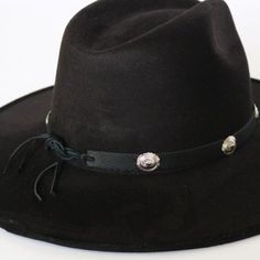 This 1/2 inch thick leather hatband is decorated with oval metal conchos. It is adjustable with a leather string tie.Made in the USASoft Genuine Leather*This product is for 1 single hat band. Hat not included. 100% Leather Austin Accent Hat Band Black Leather Silver Conchos Adjustable Western Concho Hat Bands For Country Events, Adjustable Flat Brim Felt Hat For Ranch, Country Style Concho Hat Band For Rodeo, Adjustable Vintage Felt Hat For Fall, Adjustable Western Fedora For Rodeo, Adjustable Brimmed Country Style Felt Hat, Adjustable Brimmed Country Felt Hat, Country Style Adjustable Brimmed Felt Hat, Western Hat Bands With Concho For Curved Brim