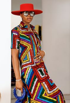 PRODUCT DETAILS: Designed in the U.S., hand-crafted in Africa Delivery within 2 weeks Multiple prints available This sophisticated unlined kaftan dress is designed with traditional African Ankara fabric shown in multi-colors. The buttoned front style is perfect for making a grand impression! Can be worn as evening wear to various events such as weddings, dinner parties and other formal occasions. Model is 5'9 CUSTOM: You pick your fabric and style @ Custom Clothes. FABRIC CARE: Dry Clean. Hand W Colorful Printed Vibrant Dresses, Multicolor Printed Shirt Dress For Vacation, Multicolor Bohemian Dress With Geometric Pattern, Bohemian Multicolor Geometric Pattern Dress, Traditional Multicolor Tunic Dress, Multicolor Printed Shirt Dress For Beach, Beach Multicolor Printed Shirt Dress, Multicolor Geometric Summer Dress, Multicolor Geometric Pattern Summer Dress