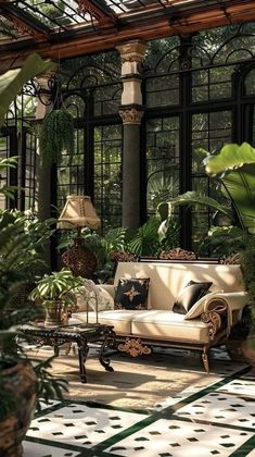 a living room filled with lots of plants and furniture