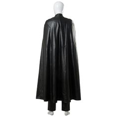 a black leather cape is shown on a mannequin's head and torso