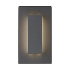 a light that is on the side of a wall with a square shape in it