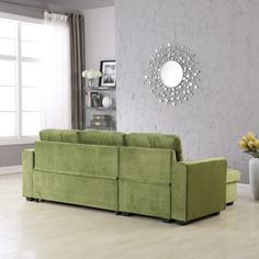 a living room with a large green couch