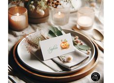 a table set with place cards and candles