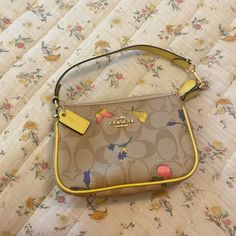 Cute Mini Purse In New Condition Yellow Coach Shoulder Bag With Gold-tone Hardware, Coach Yellow Shoulder Bag With Gold-tone Hardware, Yellow Coach Satchel Shoulder Bag, Coach Yellow Satchel Shoulder Bag, Yellow Coach Bag With Gold-tone Hardware, Coach Yellow Bag With Gold-tone Hardware, Yellow Pouch Bags For Spring, Everyday Yellow Coach Bags, Yellow Spring Pouch Bags