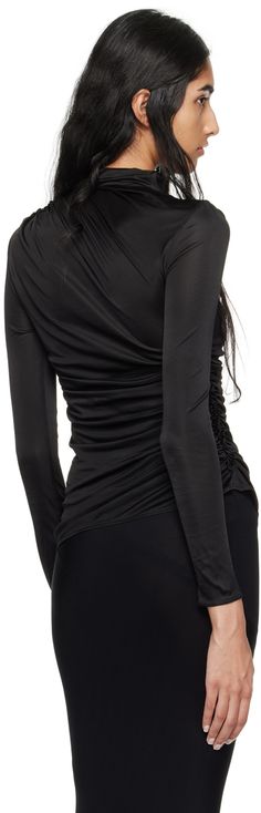 Semi-sheer stretch nylon jersey turtleneck. Ruching throughout. · Draped construction · Turtleneck Supplier color: Black Black Second-skin Top For Party, Black Ruched Evening Blouse, Elegant Ruched Tops For Layering, Elegant Second-skin Tops For Night Out, Elegant Tops With Ruched Sides For Evening, Elegant Evening Tops With Ruched Sides, Fitted Evening Top With Ruched Sides, Fitted Tops With Ruched Sides For Evening, Evening Stretch Blouse With Ruched Detail