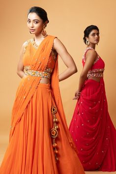 Buy Orange Georgette Embellished Cutdana V Neck Draped Lehenga And Blouse Set For Women by Quench A Thirst Online at Aza Fashions. Orange Sets For Reception And Festivals, Orange Pre-draped Saree With Unstitched Blouse For Party, Bollywood Style Orange Sets For Reception, Orange Anarkali Set With Cutdana For Reception, Orange Choli With Dupatta In Traditional Drape, Orange Sharara With Pallu For Reception, Orange Choli With Traditional Drape For Reception, Orange Cutdana Anarkali Set For Reception, Orange Designer Wear Sets With Traditional Drape