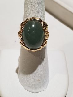 You are viewing a beautiful 14k mings green translucent jade cabochon ring. The total weight of the ring is approx.8.6 grams. The ring size approx.5 3/4 can size up or down. The ring itself measures approx.21mm x 19mm wide. Beautiful green jade translucent cabochon. Send me a message if you have any question. MAKE AN OFFER Yellow Gold Jade Cabochon Ring, Green Emerald Oval Cabochon Ring Stamped 14k, Oval Jade Rings In Yellow Gold, 14k Gold Green Gemstone Dome Ring, Green Oval Cabochon 14k Stamped Jewelry, Gold Jade Cabochon Rings, Gold Rings With Jade Cabochon, Formal Yellow Gold Jade Ring, Formal Green 14k Gold Dome Ring