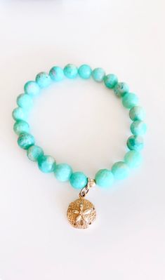 Amazonite - Soothes the spirit and calms the soul, connected with warrior women, feel the calm and power when you wear this stone. 8mm Faceted beads on a strong stretch cord. Choose the charm of your choice! I chose the sand dollar, legend told that its mermaid coins and a symbol of the Easter story. Open it up and 5 tiny doves come out. I love the freedom and protection of that ;) Spiritual Amazonite Stretch Bracelet As Gift, Casual Hand-strung Jewelry For Meditation, Meditation Beaded Bracelets With Amazonite, Amazonite Beaded Bracelets For Meditation, Spiritual Stretch Bracelet With Round Amazonite Beads, Spiritual Amazonite Stretch Bracelet With Round Beads, Spiritual Stretch Bracelet With Amazonite Beads, Adjustable Turquoise Stretch Bracelet For Meditation, Spiritual Amazonite 8mm Beads Jewelry