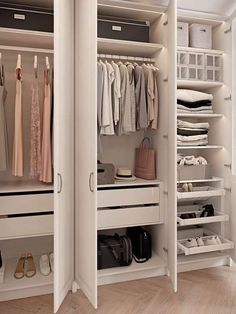 an open closet with clothes, shoes and handbags on the shelves next to it