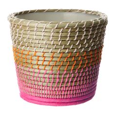 a woven basket with orange, pink and white stripes on the bottom is shown in front of a white background