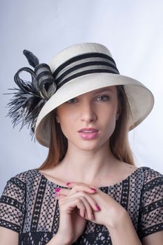 A gorgeous elegant wide brim hat made from high quality ivory parasesal with an astonishing black and ivory decoration and black feathers. Inspired from Audrey Hepburn style, its wide brim make it really special and suits almost all face types. The hat is hand blocked on a wooden block and hand stitched to perfection at Irina Sardareva millinery atelier. It is great to wear on Derby races, Royal Ascot ,Cocktail parties, Weddings, Tea parties, etc. This hat is in size 22 1/4'' (57 cm) . It can be made with different decoration like Coral. This hat is MADE TO ORDER so give us 7 working days to make it! ♠ COLORS - this hat can be made in Ivory and Navy with different decoration. You can choose it from the menu when you order the hat. ♠ SIZES  - This hat is 22 1/2 inches (57 cm) size. Please c White Fedora Sun Hat For Formal Events, White Panama Hat For Kentucky Derby Formal, White Panama Hat For Kentucky Derby, Fitted Elegant Panama Hat For Formal Occasions, Wide Brim Panama Hat For Formal Occasions, White Elegant Panama Hat, Elegant White Adjustable Panama Hat, Chic Wide Brim Panama Hat For Kentucky Derby, Cream Cloche Hat For Evening